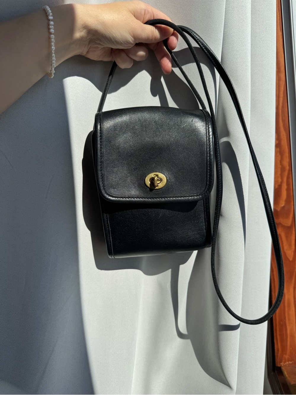 Classic Black Leather Crossbody Bag with Gold Turn-Lock